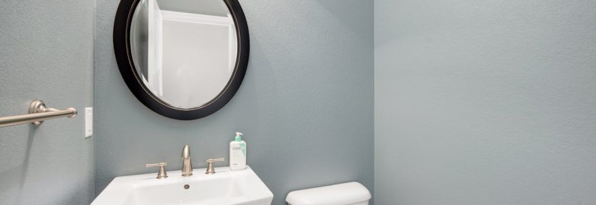 plumber Ferndale inspecting bathroom pipes for signs of leaks